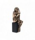 Nude female sculpture sitting on a pedestal - 10074